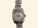 an image of a woman ' s wrist watch on a white background