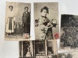 many old photographs of asian women on the wall