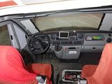 two seats in the driver ' s seat of a van