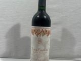 a bottle of wine that is sitting on a table