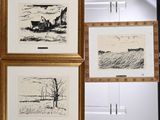 three framed drawings of a farm and a house in a field