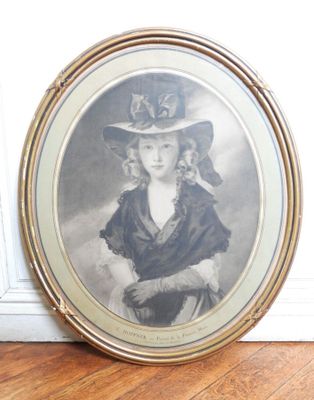 an old picture of a woman wearing a hat and a dress