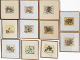 a lot of framed pictures on the wall of a room