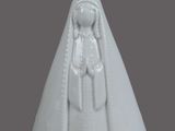 white porcelain figurine of a woman with a crown on her head