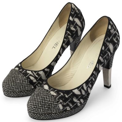 black and white high heeled shoes on a white background