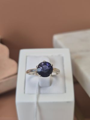 a ring that is sitting in a box on a table