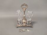 a silver plate with a pair of scissors next to it