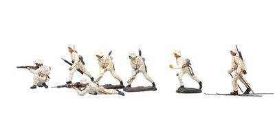 several figurines of men in white uniforms are lined up in a line