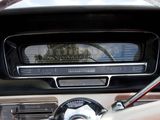 a car dashboard with a radio and a steering wheel