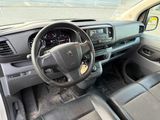the interior of a car with a steering wheel and dashboard controls