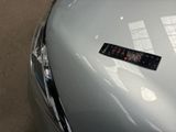 a sticker on the hood of a silver car