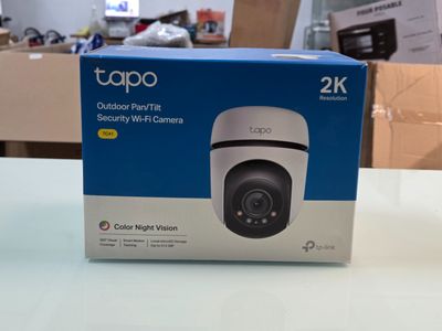 a white box on a table with a camera in it