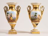 pair of antique gold vases with hand painted scenes on them