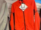two jackets hanging on a rack in a store
