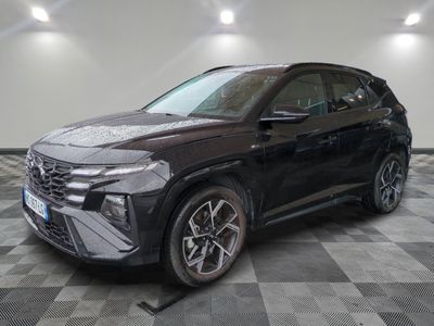 a black volkswagen suv parked on a checkered floor in a showroom