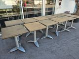 four tables that are sitting on the concrete floor