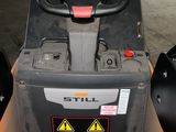 an image of a forklift in a parking lot