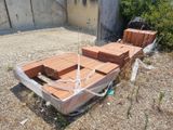a boat that is sitting on the ground in the dirt