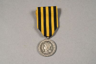 an image of a medal with a coin on it