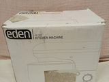 an open box of a kitchen machine sitting on top of a table