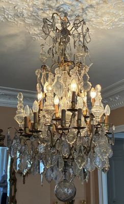 a chandelier that is hanging from the ceiling