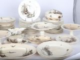 a lot of plates and bowls that are on a table