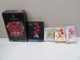 a bunch of cards and a box of flowers on a table