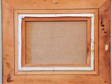 an old picture frame with a picture hanging on a wall