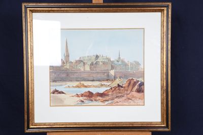 l'image d'un tableau représentant une ville, posé sur un chevalet