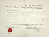 un vieux document sur lequel est apposé un cachet de cire rouge