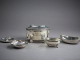 four pieces of silverware including a bowl, saucer, and spoon