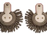 two pairs of earrings with a star on each side