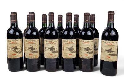 six bottles of wine are lined up in a row on a white surface