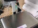 an image of a scale with a laptop on it