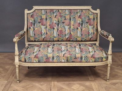 an image of a couch with a colorful patterned upholstered seat