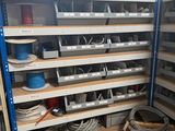 many shelves with wires and wires on them in a room