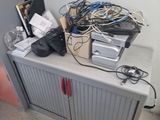 a cabinet with a bunch of wires on top of it