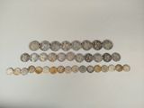 a group of coins sitting on top of a table next to each other