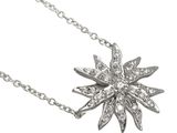 a close up of a necklace with a flower design on a chain