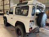 an image of a white land rover in a garage