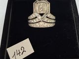 a close up of a diamond ring in a box with a price tag