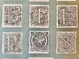 an old book with a bunch of different type of letters on it