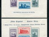 deux timbres représentant une ville sur fond noir