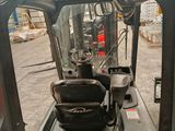 a picture of a forklift inside of a building