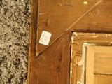 a picture of a wooden door with a sticker on it