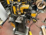 a picture of a machine that is working on a piece of wood