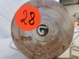 a wooden wheel that has a number on it