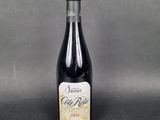 a bottle of wine sitting on top of a table