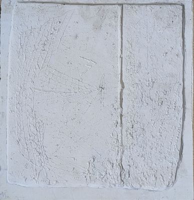 a white wall with a window on it and a clock on the wall