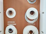 four rolls of toilet paper on the wall in the bathroom